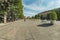 MILAN, ITALY - AUGUST 1, 2019 - Wide angle panorama of Luca Beltrami Street and the Monument of Giuseppe Garibaldi in front of