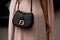 Milan, Italy - February, 21, 2024: woman wears Fendi bag, fashion blogger outfit detail.