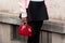 Milan, Italy - February, 22, 2024: woman wears Prada bag, fashion blogger outfit details