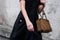 Milan, Italy - February, 22, 2024: woman wears Prada bag, fashion blogger outfit details
