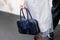 Milan, Italy - February, 22, 2024: woman wears Prada bag, fashion blogger outfit details