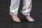 Milan, Italy - January, 25, 2024: woman wears Aquazzura high heel crystal sandals, street style