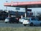 Milan, Italy - March 2002 Gas and diesel prices rising at the gas station people refueling due to russia ucraina war and financial