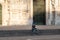 Milan, Italy - May 4, 2020: Bicyclist sitting on Duomo square. Italy enters second phase of coronavirus lockdown.