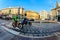 Milan, Italy - October 19th, 2015Elderly cyclist and a policeman on a motorcycle on the road in the city street Via Cordusio Milan