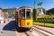 MILAN, ITALY - September 07, 2016: The old yellow tram has stopped and opened doors on the tram stop near metro station Cairoli wh