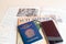 Milan, Italy â€“ July 20, 2018 : A Brazilian passport and a smartphone over a tourist magazine of South America, on a light