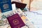 Milan, Italy â€“ July 20, 2018 : An Italian and brasilian passports with a smartphone over a tourist magazine of South America and