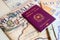 Milan, Italy â€“ July 20, 2018 : An Italian passport with a smartphone over a tourist magazine of South America, on a light