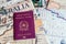 Milan, Italy â€“ July 20, 2018 : An Italian passport with a smartphone over a tourist magazine of South America, on a light