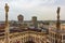 Milan skyline spires and statue of Duomo di Milano rooftop Italy