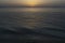 Milazzo beach on beautiful dusk with vulcano islands and orange sunset