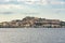 Milazzo town seen from the sea at sunset