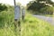 Milestone and road with grass