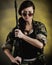 Militarized Young Woman WIth Assault Rifle