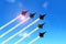 Military aerobatic jets under blue sky during Air Show
