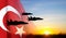 Military aircraft against the sunset and Turkey flag