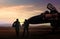 Military Aircraft and pilot at airfield in silhouette scene