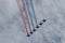 Military aircraft in the sky over St. Petersburg paint in the sky of the Russian tricolor