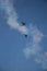 Military airplanes lined up in a row during the Russian military parade on bright blue sky with clouds