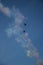 Military airplanes lined up in a row during the Russian military parade on bright blue sky with clouds