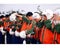 A military airport, a group of pilots in next to a row of fighter helmet, sorting,