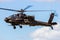 military Apache attack helicopter hovering
