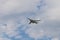 Military bomber aircraft flying in the cloudy sky