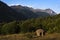 Military bunker in front of a mountain range of the Albanian Alps in northern Albania near the remote Vermosh mountain village