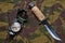 Military camo pants, compass and knife