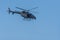 Military chopper flying through combat and war flying into the smoke and chaos and destruction. Military concept of power, force,