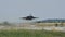 Military Combat Jet Aircraft Retracts the Landing Gear while Takeoff in Slow