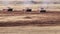 Military convoy moving through the desert dust