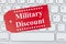 Military Discount message on a gift tag on gray keyboard