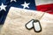 Military dog tags, the US Constitution and the American flag