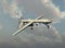 Military drone equipped with missiles flying in the sky