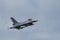 Military F16 fighter jet close up flying through the air. Royal Netherlands Air Force F16 fighter jet aircraft taking off.