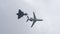 Military fighter jet intercepts a luxury private business plane in flight