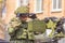 Military greeting by the commander of the crew of armored vehicles at a parade rehearsal on a city street