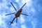 Military Helicopter flying on blue sky