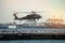 Military helicopter landing on heliport in New York City.