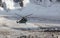 Military helicopter landing on ice of mountain galcier in Emergency situation