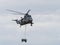 Military helicopter lifting load