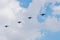 Military jet fighters fly away in the sky