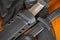 Military knives and scabbard on the wooden background