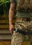 A military man holds a medical tourniquet in his hands to stop blood in first aid and prevent bleeding.