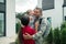 Military man hugging his wife and daughter after returning home