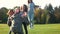 Military man hugging two daughters.