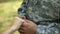 Military man putting engagement ring on woman hand, couple marriage, vow promise