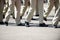 Military marching in a street. Legs and shoes in line